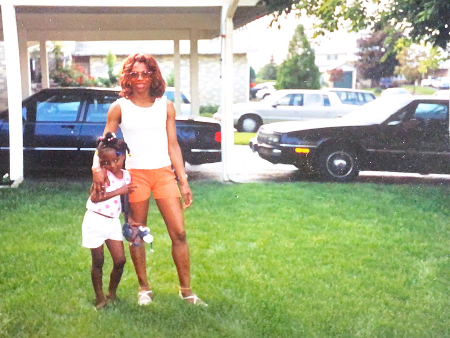 Old photograph of Sonia Marryshow with her arm around a young girl
