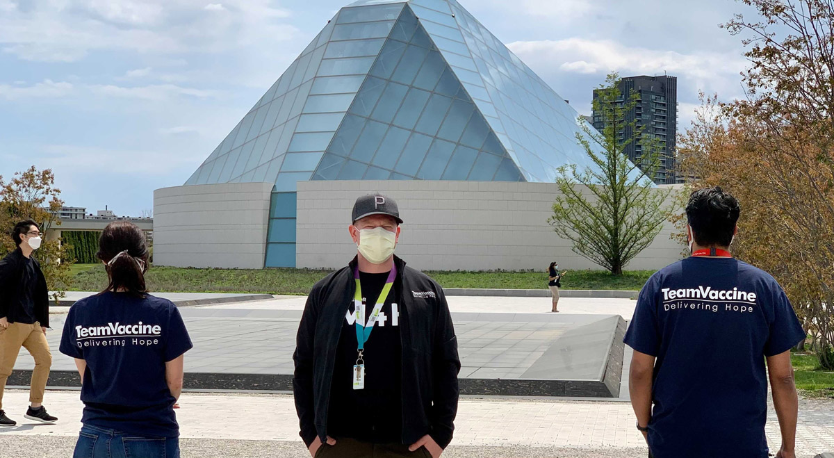 Philip Anthony and two volunteers in front of the Aga Khan Museum